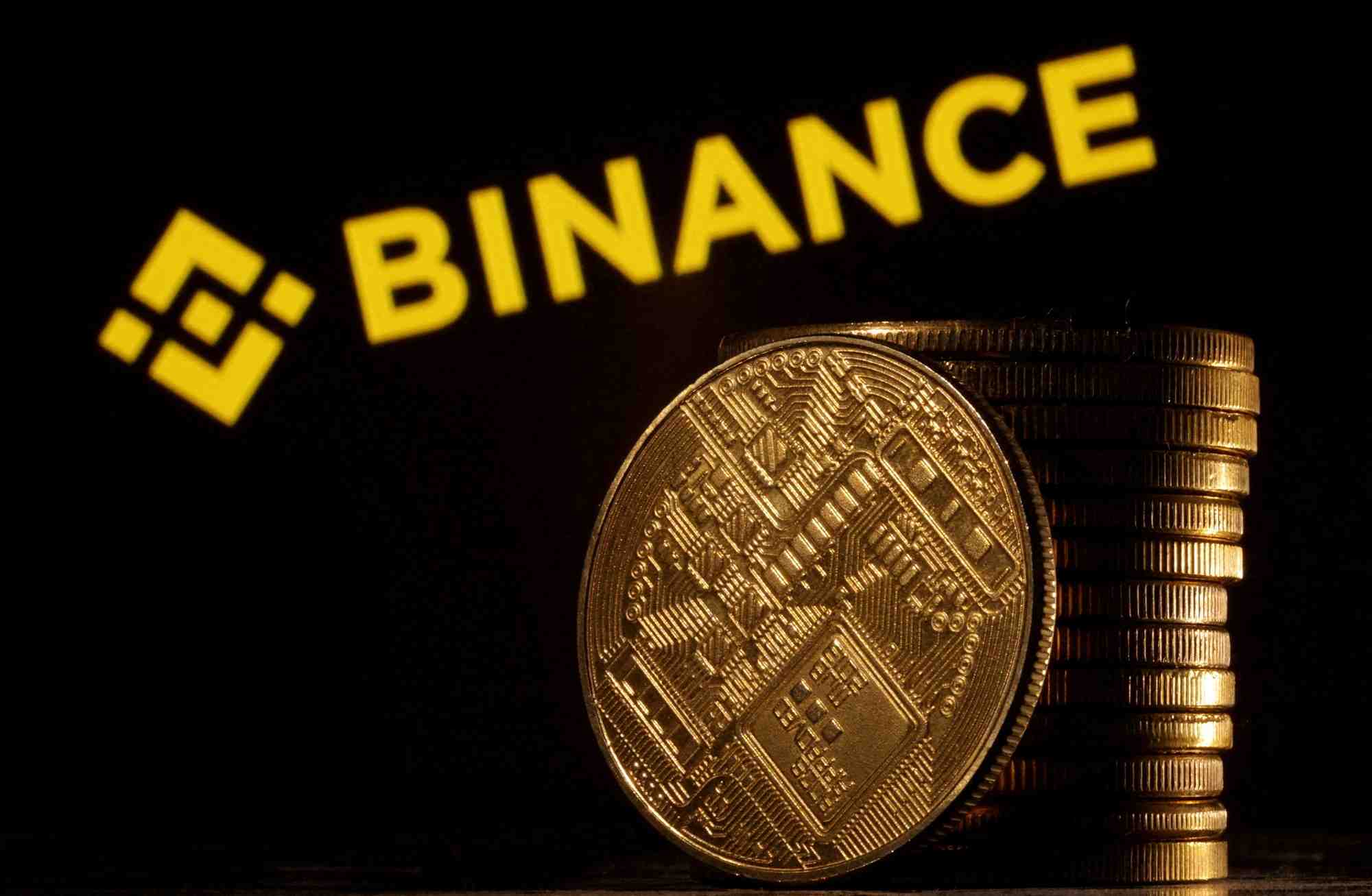 Illustration du logo de binance et des pieces de monnaies