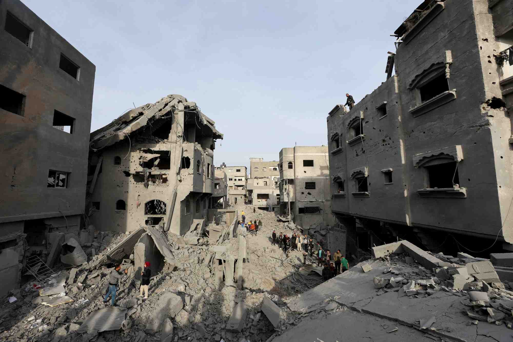 File picture palestinians inspect damage at the site of an israeli strike on a house, at nuseirat refugee camp