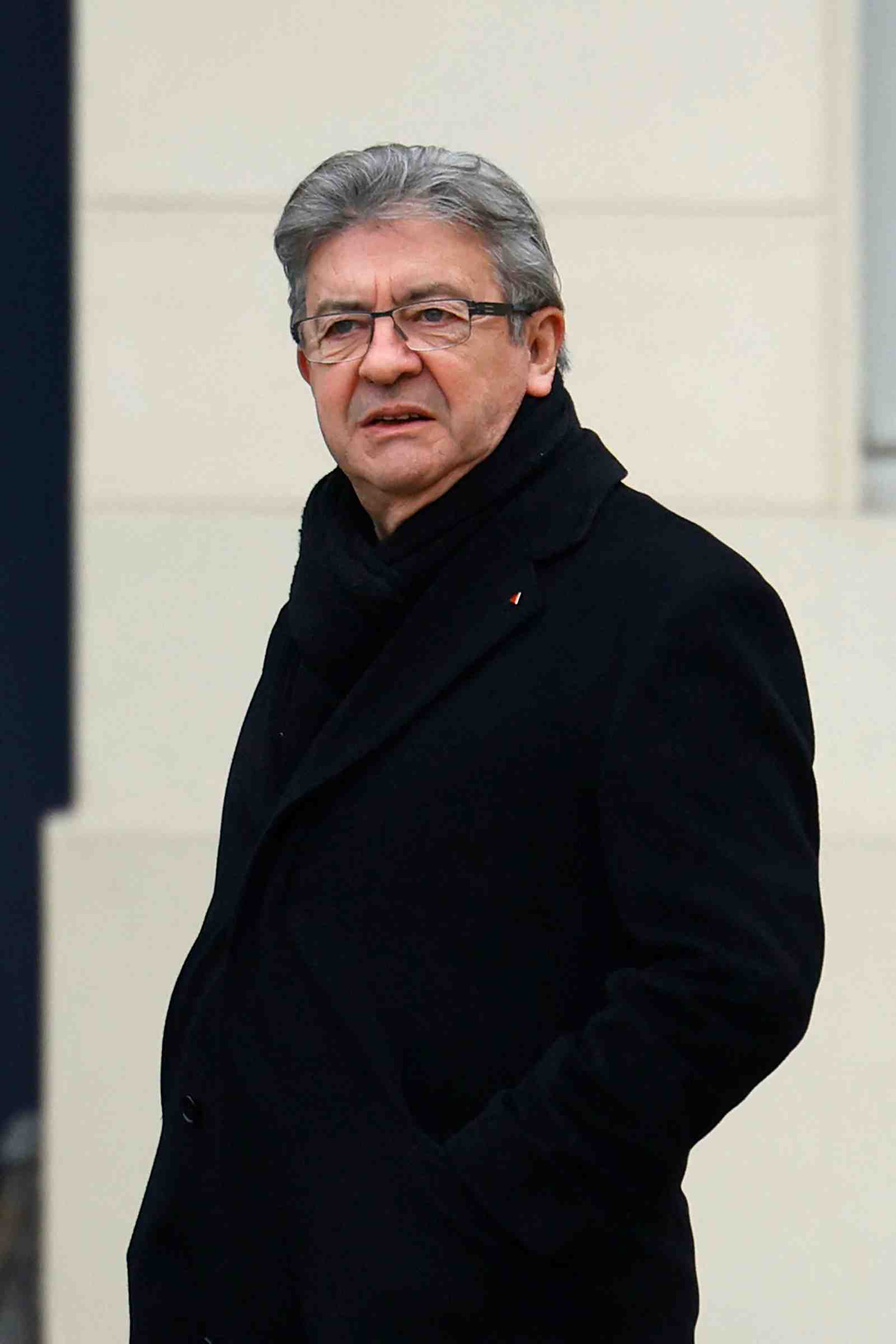 Jean-luc melenchon, chef de file de la france insoumise, devant l'assemblee nationale a paris