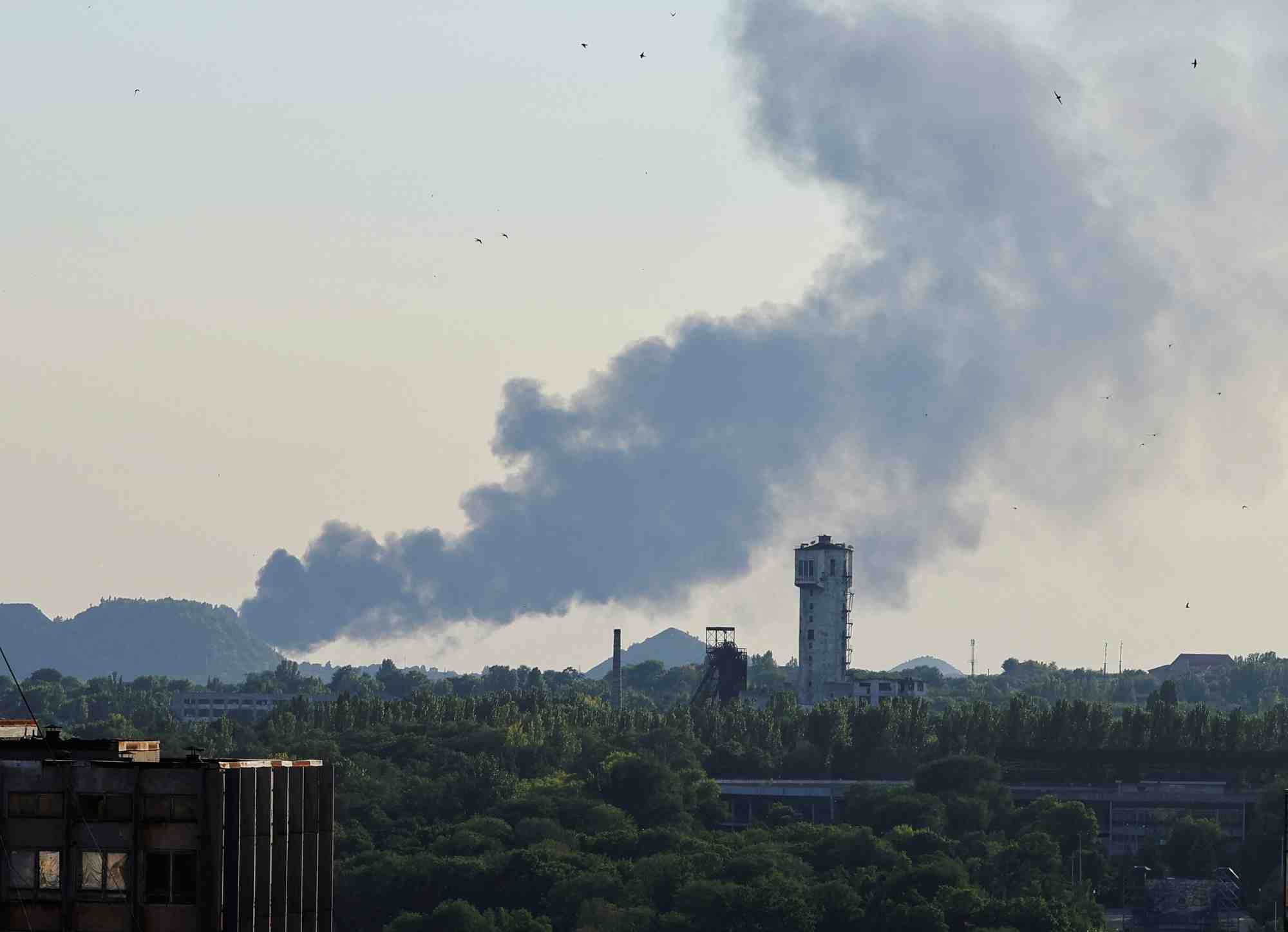 Smoke rises after shelling during ukraine-russia conflict in donetsk