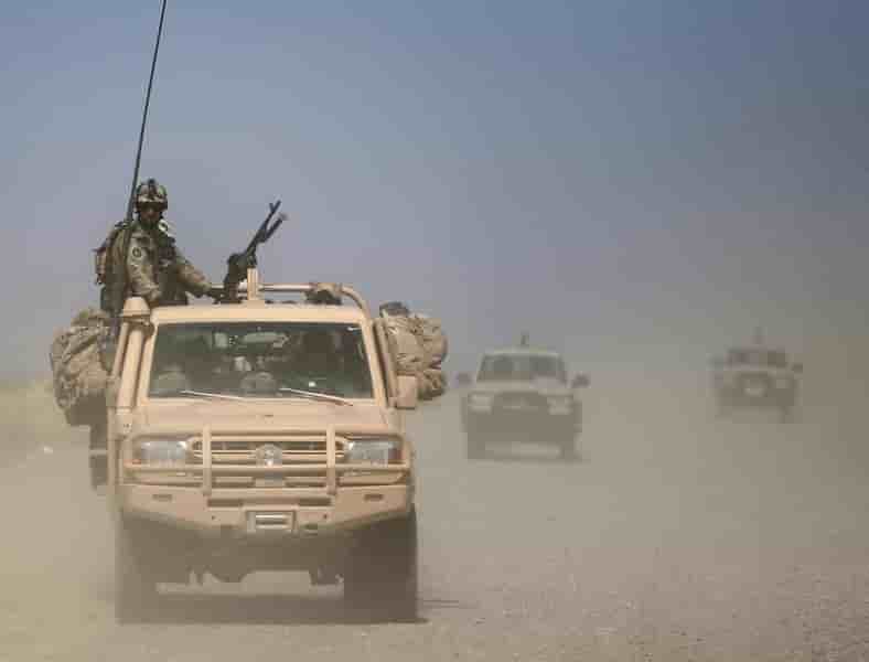 Afghan security forces patrol at the kunduz