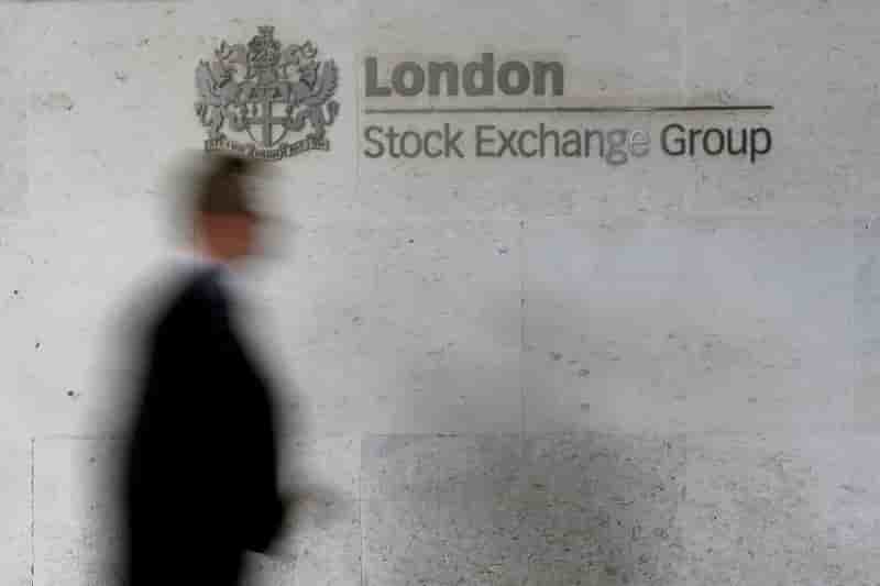 File photo: file photo: a man walks past the london stock exchange in the city of london