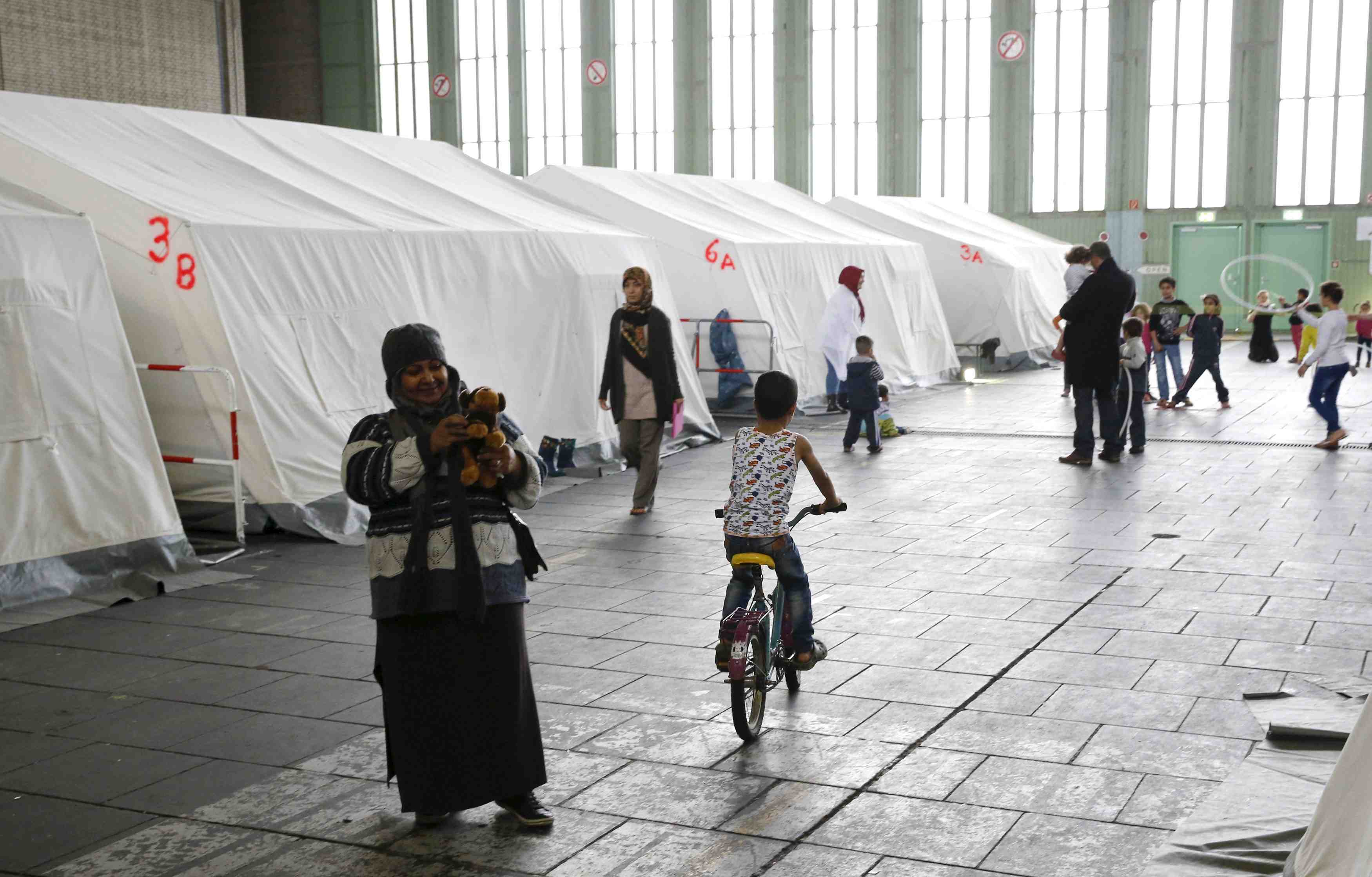 Merkel veut "drastiquement reduire" l'arrivee de refugies