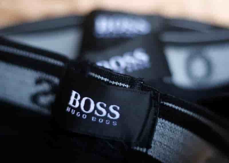 Hugo boss releve son objectif de reduction des couts