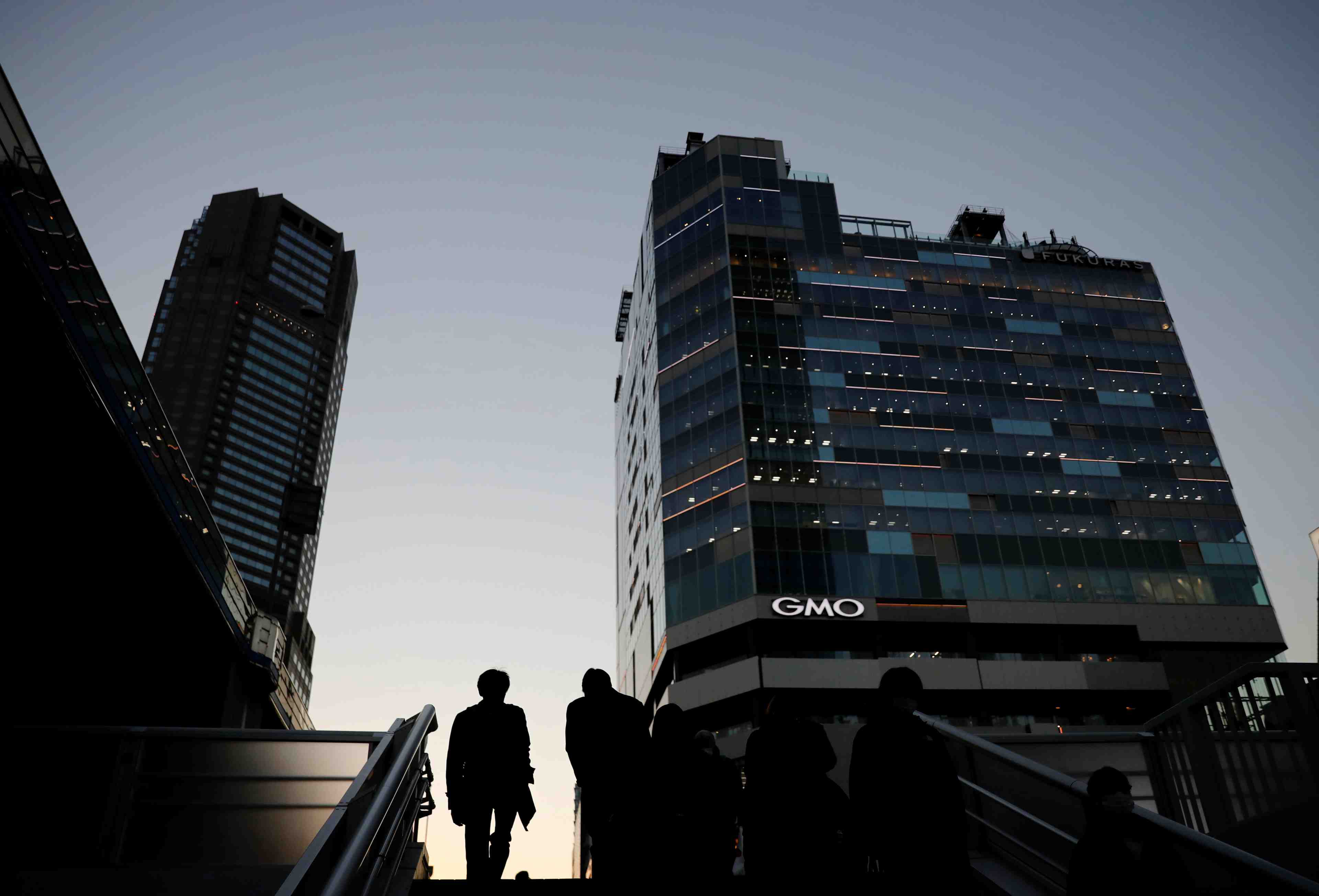 Japon: l'economie a progresse plus qu'attendu au quatrieme trimestre, portee par le commerce