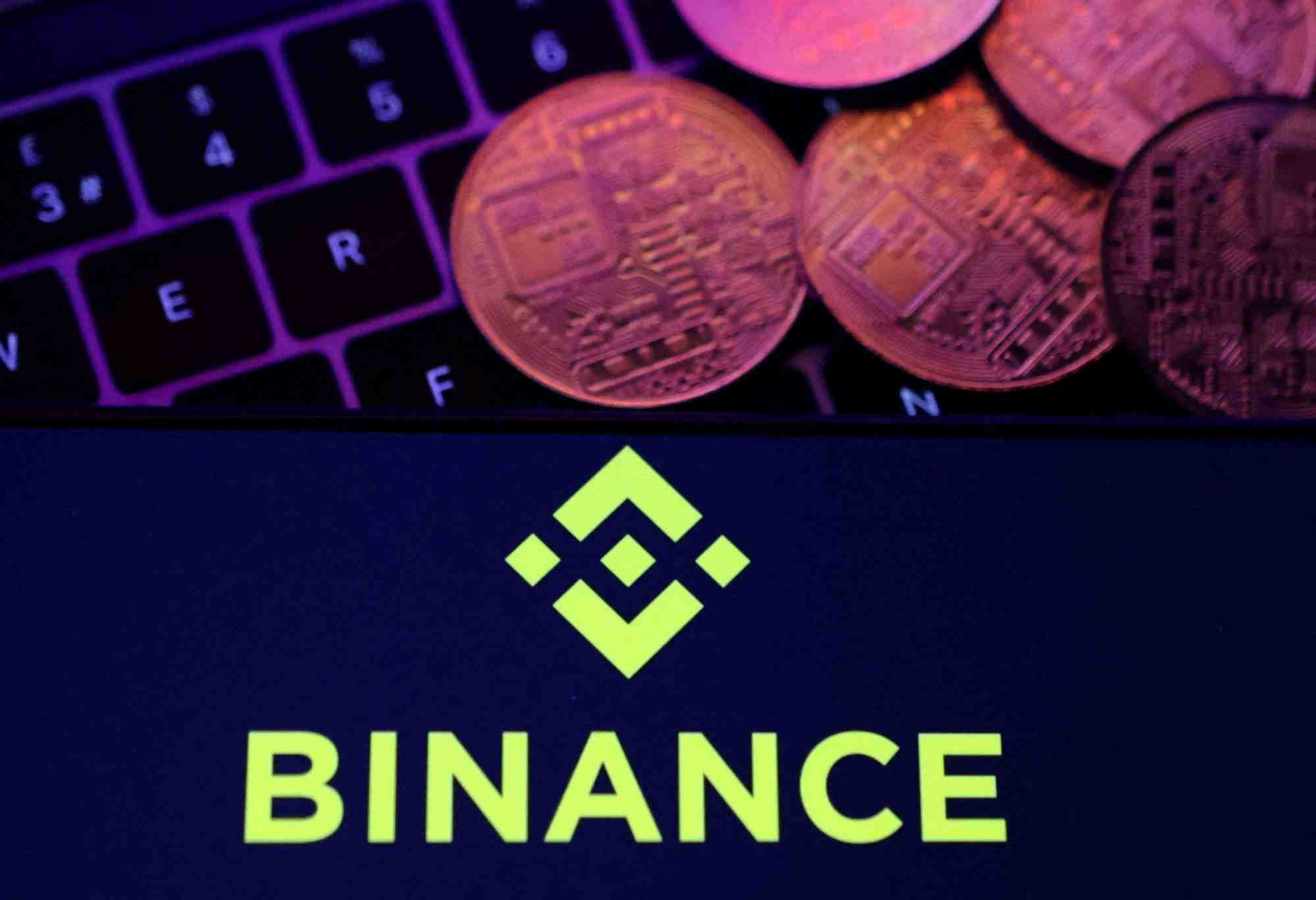 L'illustration montre le logo de binance et la representation des crypto-monnaies