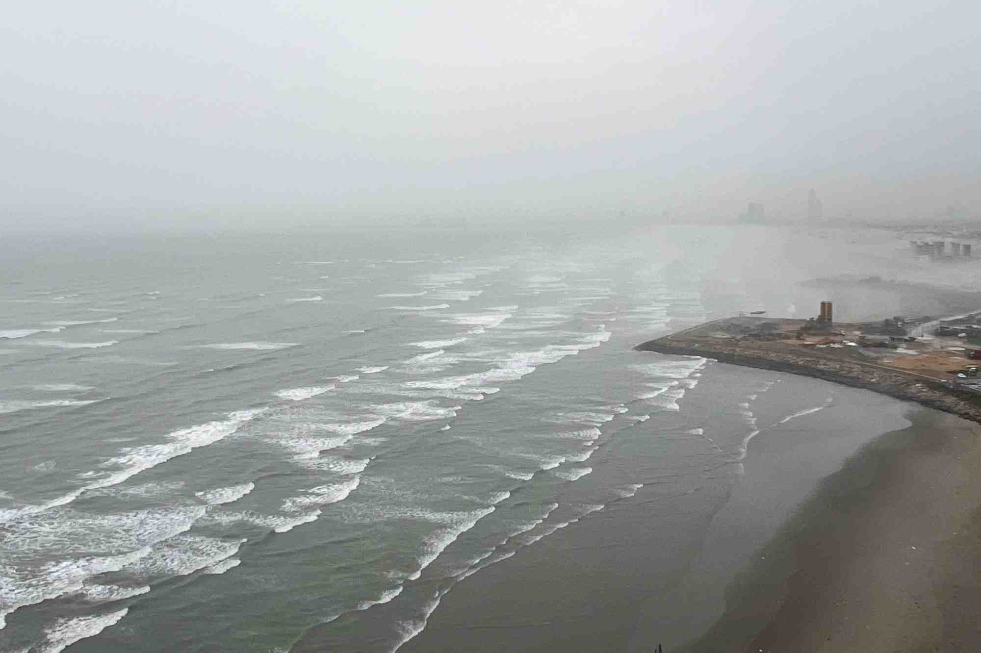 View of sea waves seen from a residential apartment, at clifton beach in karachi