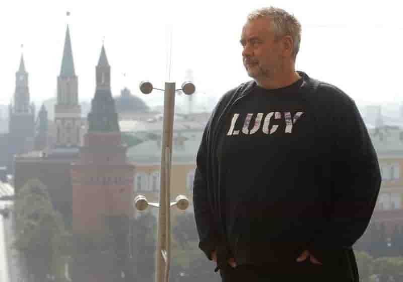 French film director luc besson poses during a photo call in front of moscow's kremlin