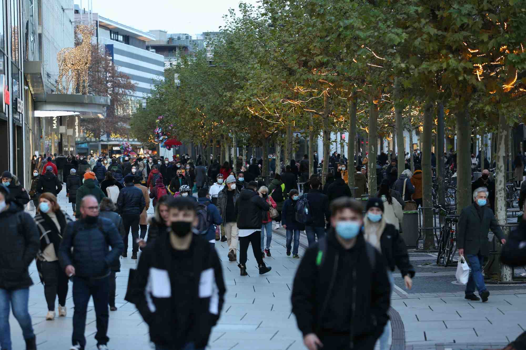 People walk along the zeil shopping promenade, in frankfurt