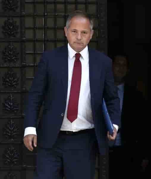European central bank executive board member coeure leaves after a meeting with greece's prime minister samaras in athens
