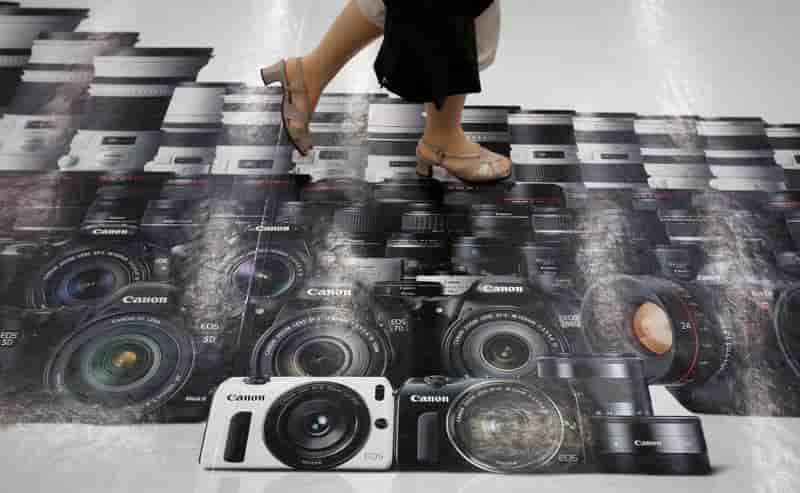 Canon soutenu par les équipements de bureau, la photo à la peine