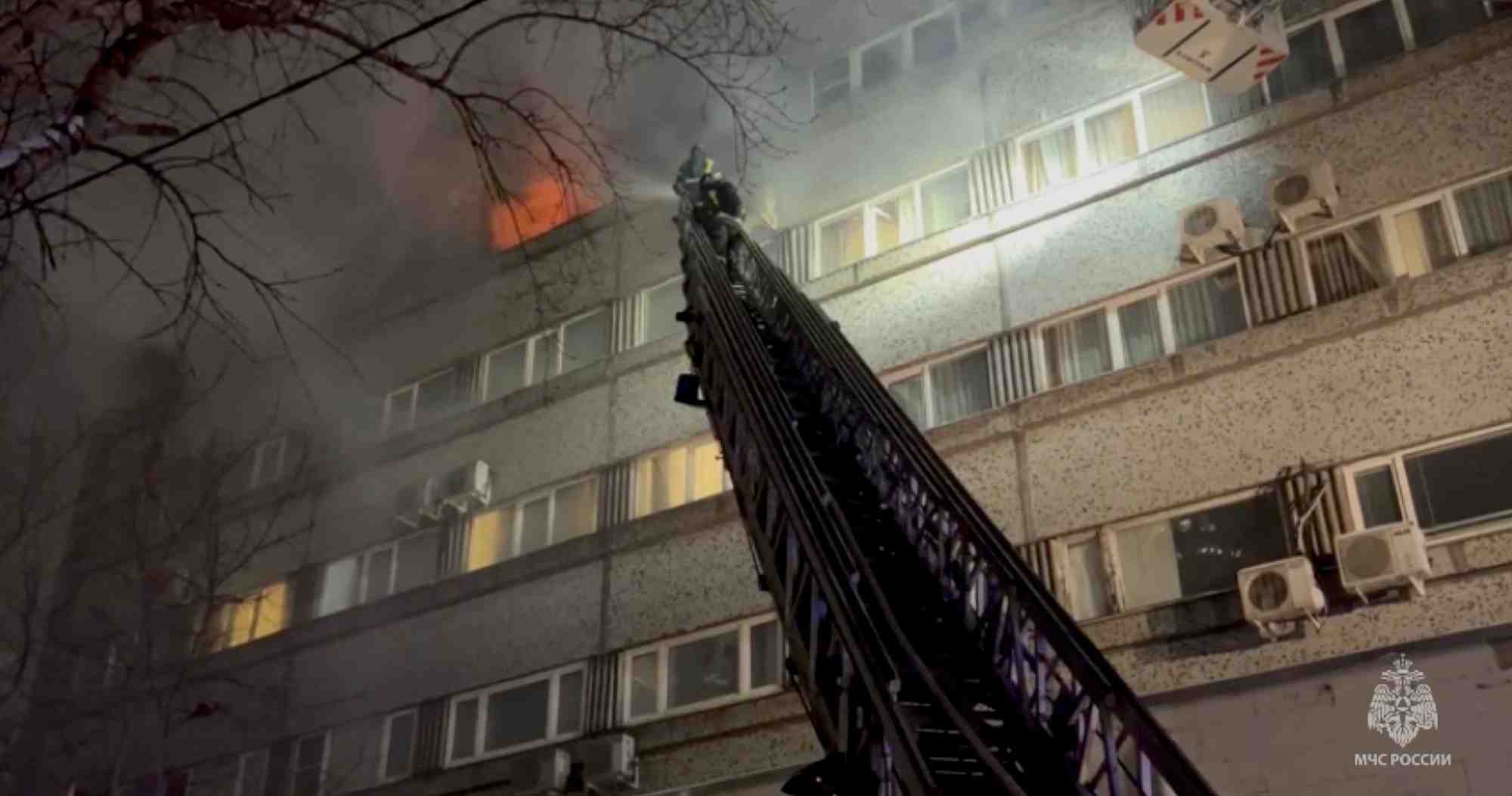 Firefighters put out a fire in the building which houses the mkm hotel in moscow