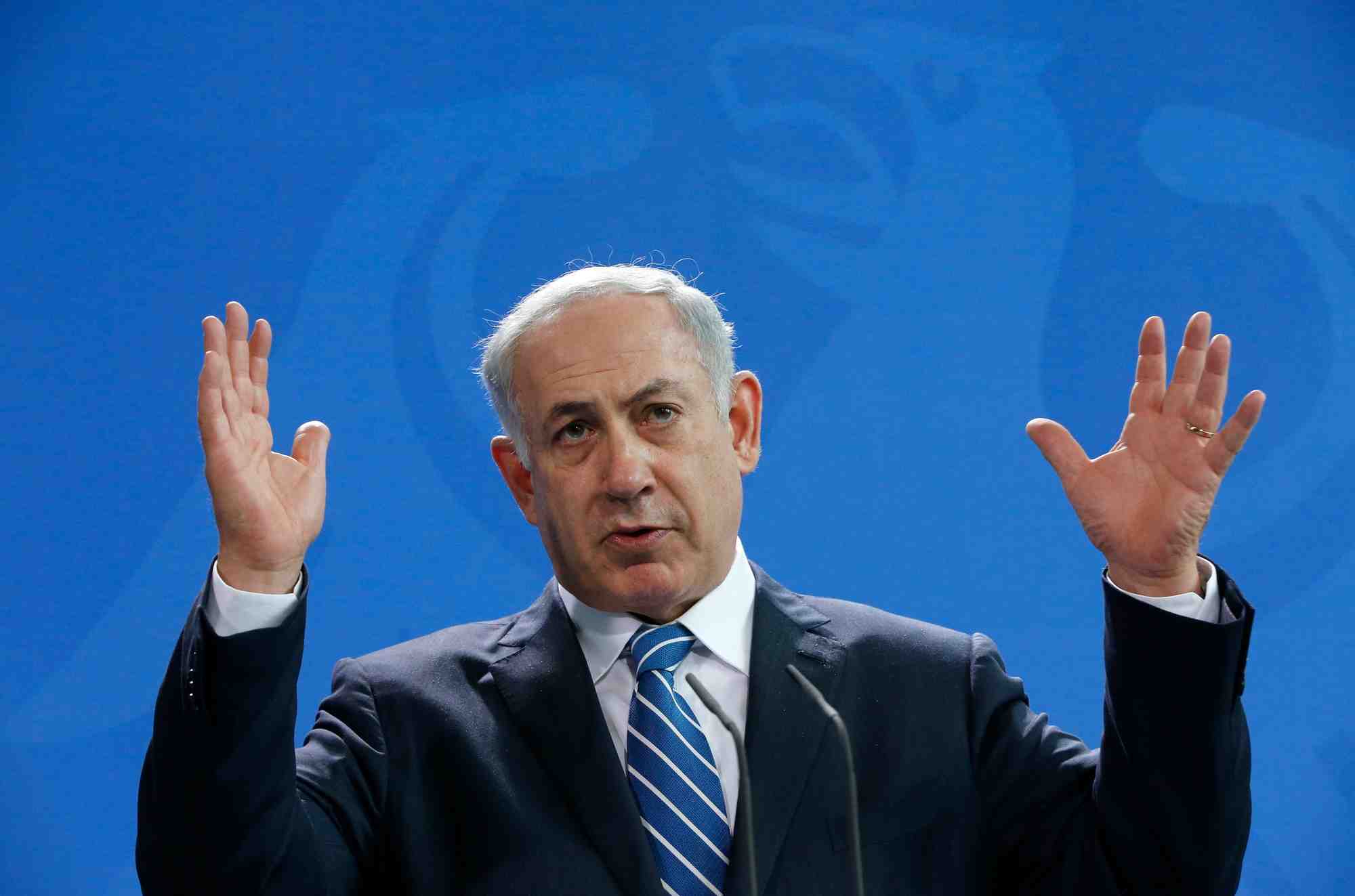 Israeli pm netanyahu gestures as he addresses a news conference at the chancellery in berlin