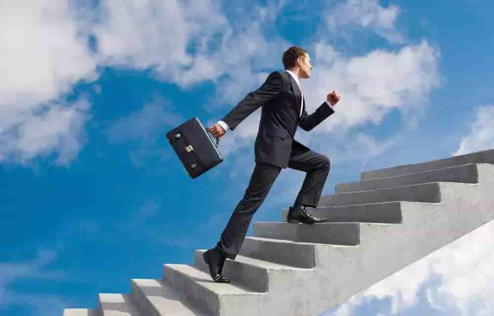 confident-businessman-with-briefcase-walking-upstairs-1000x641