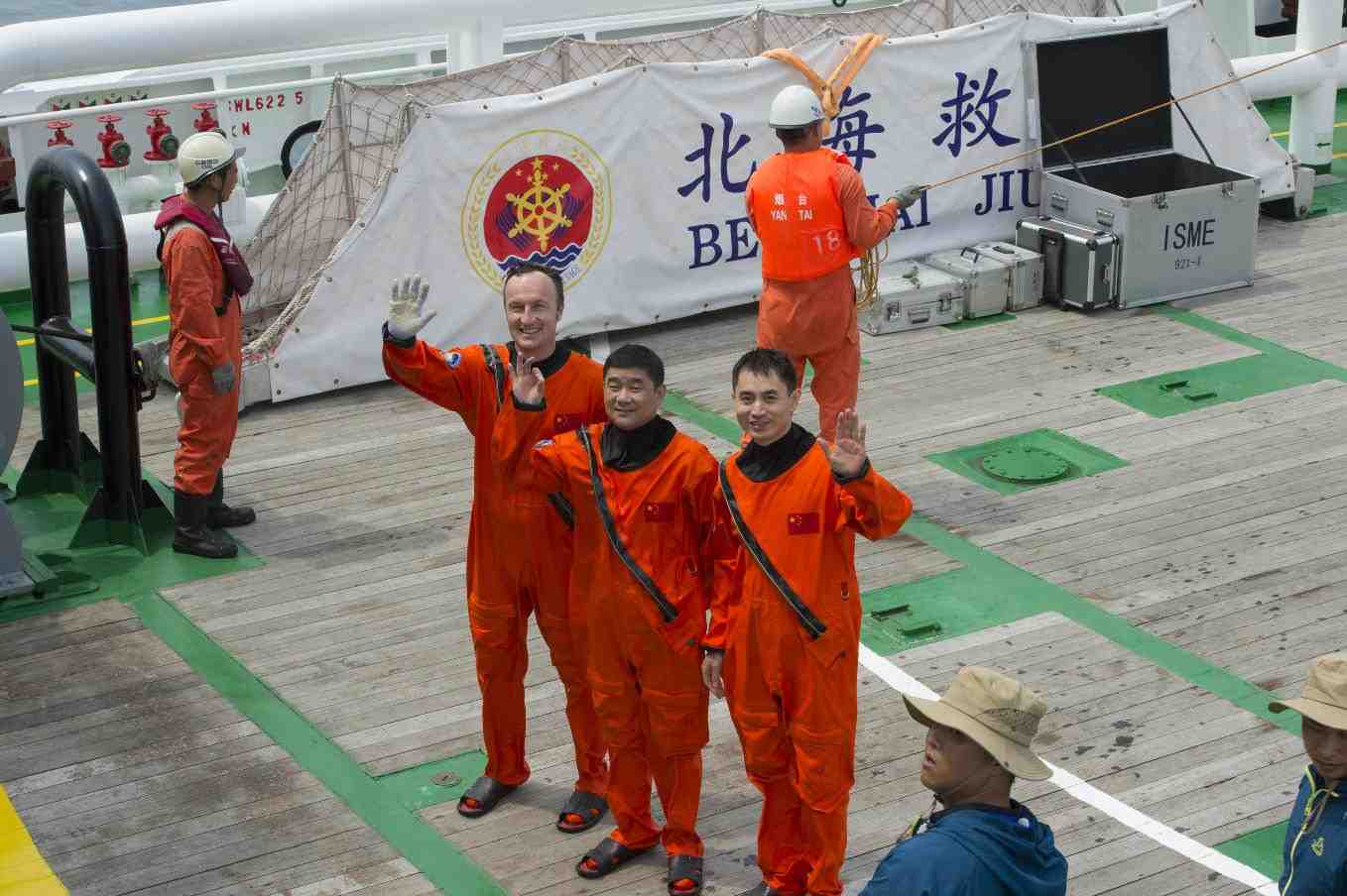 ESA astronaut Matthias Maurer (left) with Chinese colleagues.