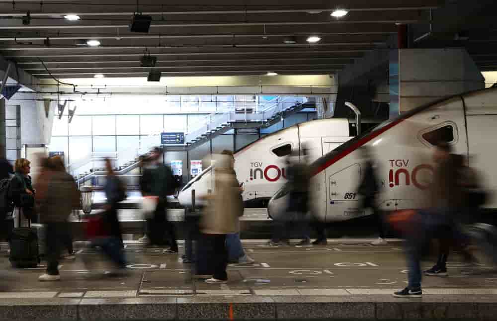 Passengers walk past a TGV inOui high speed train at the Gare Montparnasse train station in Paris, as French state-owned railway SNCF workers have called for a strike this week in France, May 6, 2025. REUTERS/Abdul Saboor - A call for strike by SNCF...