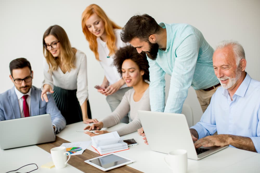 Multiracial business people working on project in office - Multiracial business people working in office